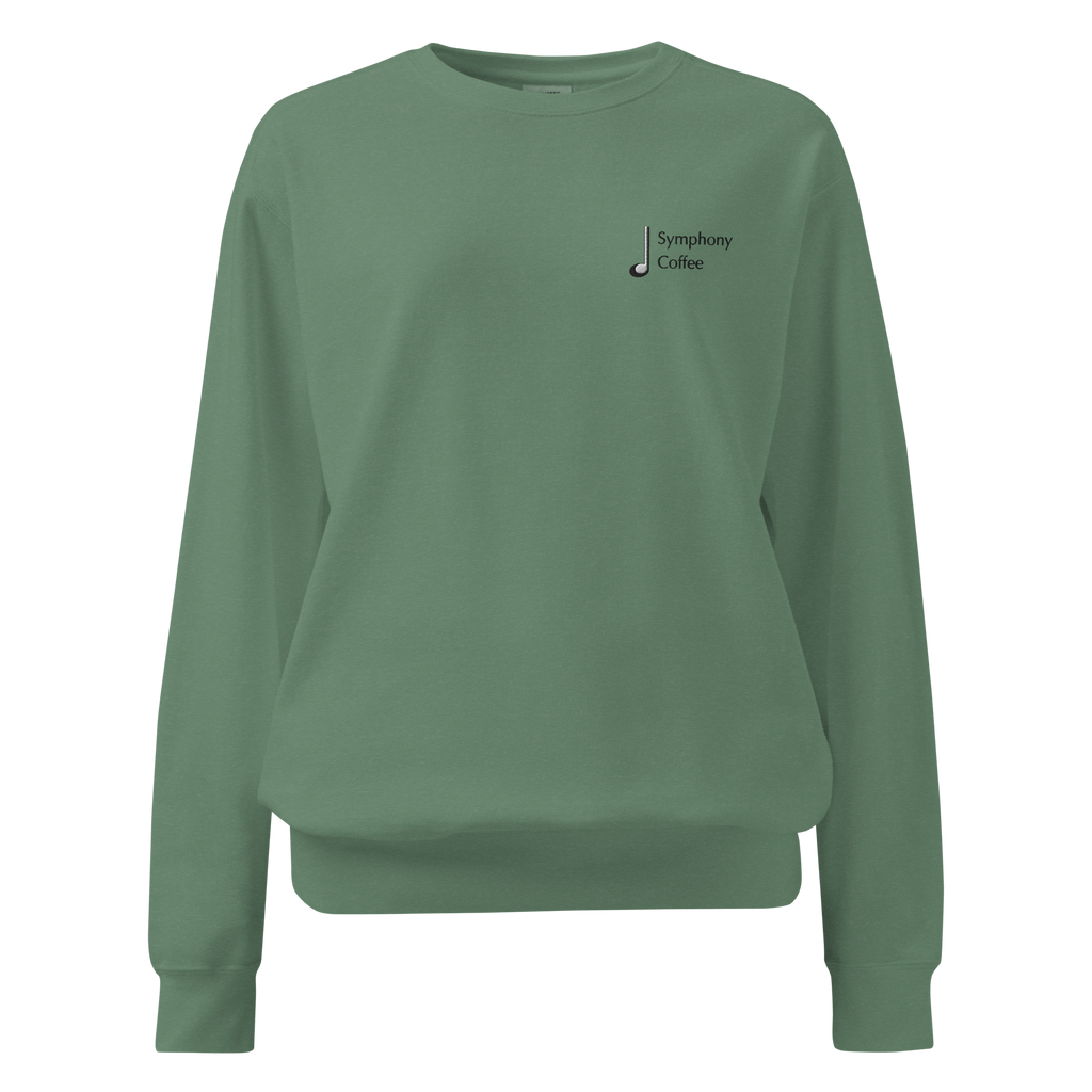 Green sweatshirt with a logo on the chest against 